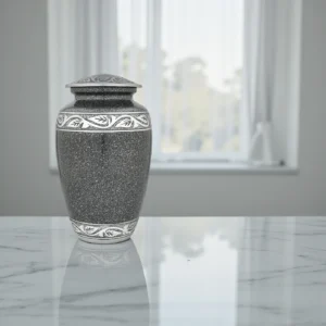 The Eternal Laska, a high-quality affordable urn for human ashes, shown in cream-white with hand-etched silver bands.