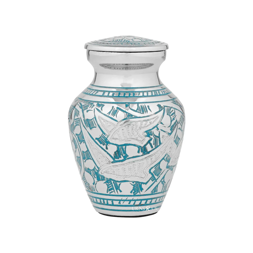 Going Back Home Sharing Urn for ashes, a small silver keepsake urn with a hand-etched flying birds (doves) design in blue.