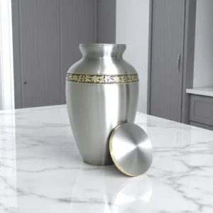 Premium brass cremation urn in silver and gold finish