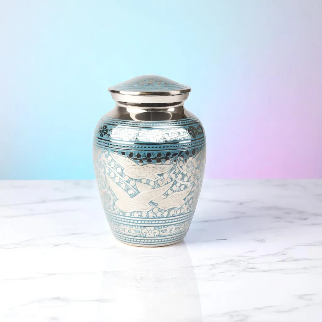 Small silver and blue cremation urn with dove engravings – Dove Whisper memorial urn for ashes