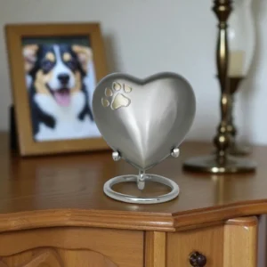 Golden-finish heart keepsake with paw print for pets