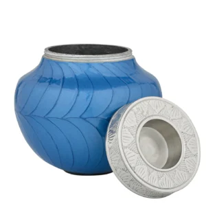Ample Serenity Blue Child Urn with its candle-holder lid resting beside the opening.