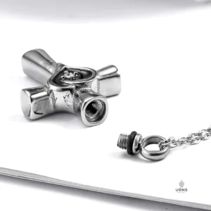 Back view of the Heart Cross Urn Necklace, shown open with the threaded screw bail removed, clearly displaying the filling chamber.