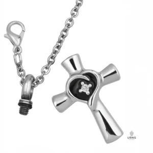 HDR enhanced image of the Heart Cross Urn Necklace for ashes, shown open with its screw bail, chain, and lobster clasp, revealing the chamber.
