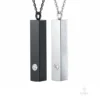 A polished silver Minimalist Bar Urn Necklace for ashes, featuring a subtle clear crystal accent, on a white background.