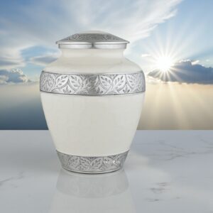 Silver Lining White Adult Cremation Urn on a marble slab with a serene background of sun and soft clouds.