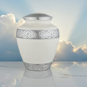 Silver Lining White Adult Cremation Urn with a glowing sun reflection creating a halo effect from behind the urn.