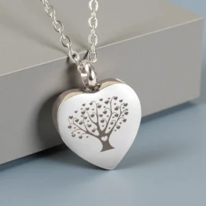 Tree of Life heart-shaped cremation jewelry for ashes, a polished stainless steel pendant. A thoughtful sympathy gift.