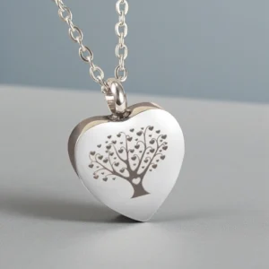 Tree of Life heart urn necklace for ashes, a stainless steel memorial keepsake shown in a lifestyle setting.