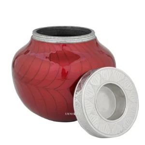 Eternal Love Red Child Urn with its candle-holder lid resting beside the opening.