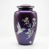 Studio front view of the Amethyst Twilight purple adult cremation urn featuring an iridescent hummingbird and flower design on a seamless white background.