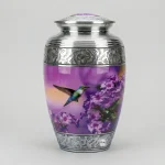 The "Sunrise Serenade" Hummingbird Urn – Adult Cremation Urn for Human Ashes – Scenic Floral Design – Purple and Silver Engraved Finish