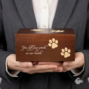 Decorative wooden urn for pet ashes with paw prints for dog or cat memorial
