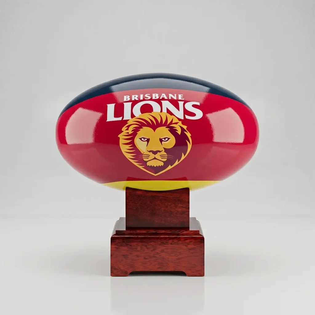 A front-on view of the Brisbane Lions AFL cremation urn showing the official club logo and maroon colours on a polished mango wood display stand.
