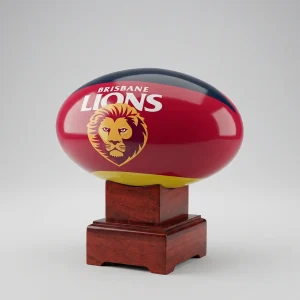 A front-on view of the Brisbane Lions AFL cremation urn showing the official club logo and maroon colours on a polished mango wood display stand.