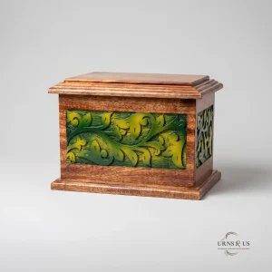 Front view of a polished wooden adult cremation urn featuring vibrant green