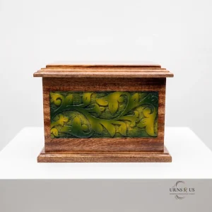 Front view of a polished wooden adult cremation urn featuring vibrant green carved vine panels, set against a clean, minimalist background.