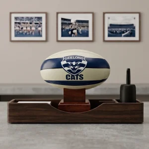 A sleek Geelong Cats AFL Cremation Urn used as a memorial piece on a modern executive desk.