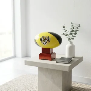 The Richmond Tigers AFL urn shown on a contemporary side table in a bright living room.