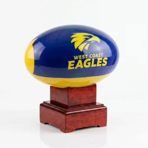 Side angle of the West Coast Eagles AFL football urn showing the high-gloss finish and sturdy mango wood pedestal.