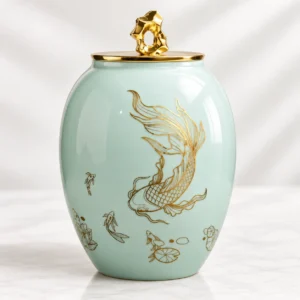 Celadon Koi ceramic cremation urn for ashes with gold koi design front view