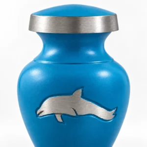 Silver dolphin detail on blue cremation keepsake urn for ashes