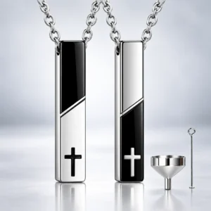 Cross bar urn necklace for ashes in both black and silver colour variations with chain and filling accessories