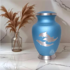 Blue cremation urn with dolphin design, Aria's Dolphin's Grace