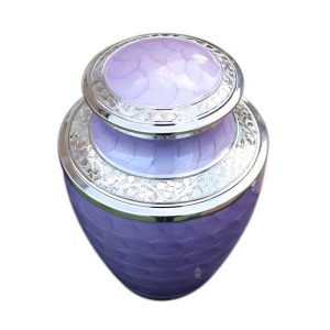 Soft lavender cremation urn complemented by lustrous silver designs