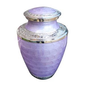 Lavender-hued urn with reflective silver embellishments for ashes