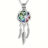 Rainbow dreamcatcher ashes locket close-up, iridescent memorial necklace with feathers Australia.