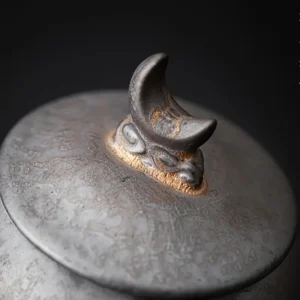 rustic antique urn showing closeup of top lid
