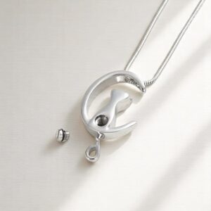 urn pendant shaped like cat on moon